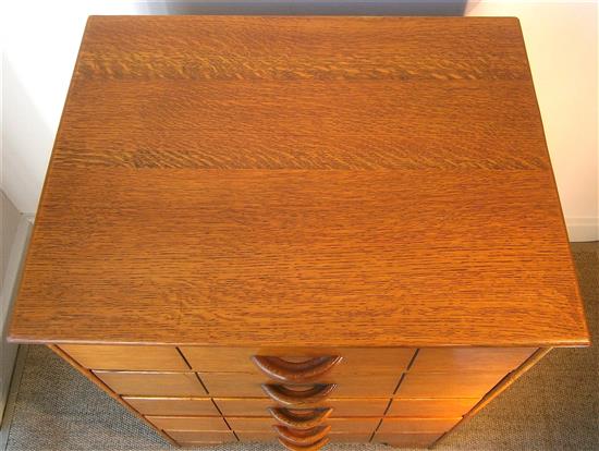 A Heals style golden oak five drawer chest W.56cm